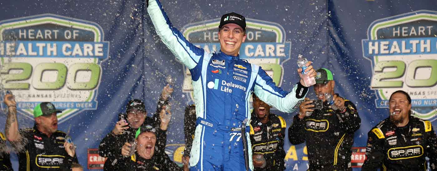 KANSAS CITY, KANSAS - MAY 10: Carson Hocevar, driver of the #7 Delaware Life Chevrolet, celebrates in victory lane after winning the NASCAR Craftsman Truck Series Heart of Health Care 200 at Kansas Speedway on May 10, 2025 in Kansas City, Kansas. (Photo by Chris Graythen/Getty Images)
