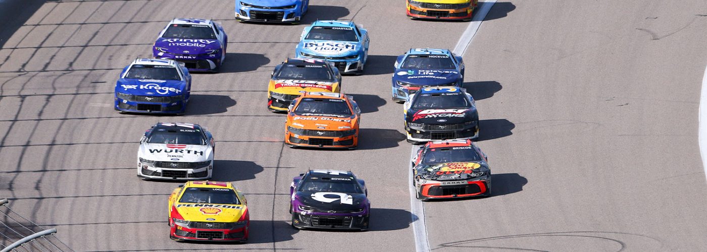 Kyle Larson, driver of the #5 HendrickCars.com Chevrolet, and Christopher Bell, driver of the #20 Reser's Fine Foods Toyota, race during the NASCAR Cup Series AdventHealth 400 at Kansas Speedway on May 11, 2025 in Kansas City, Kansas. (Photo by Jamie Squire/Getty Images)